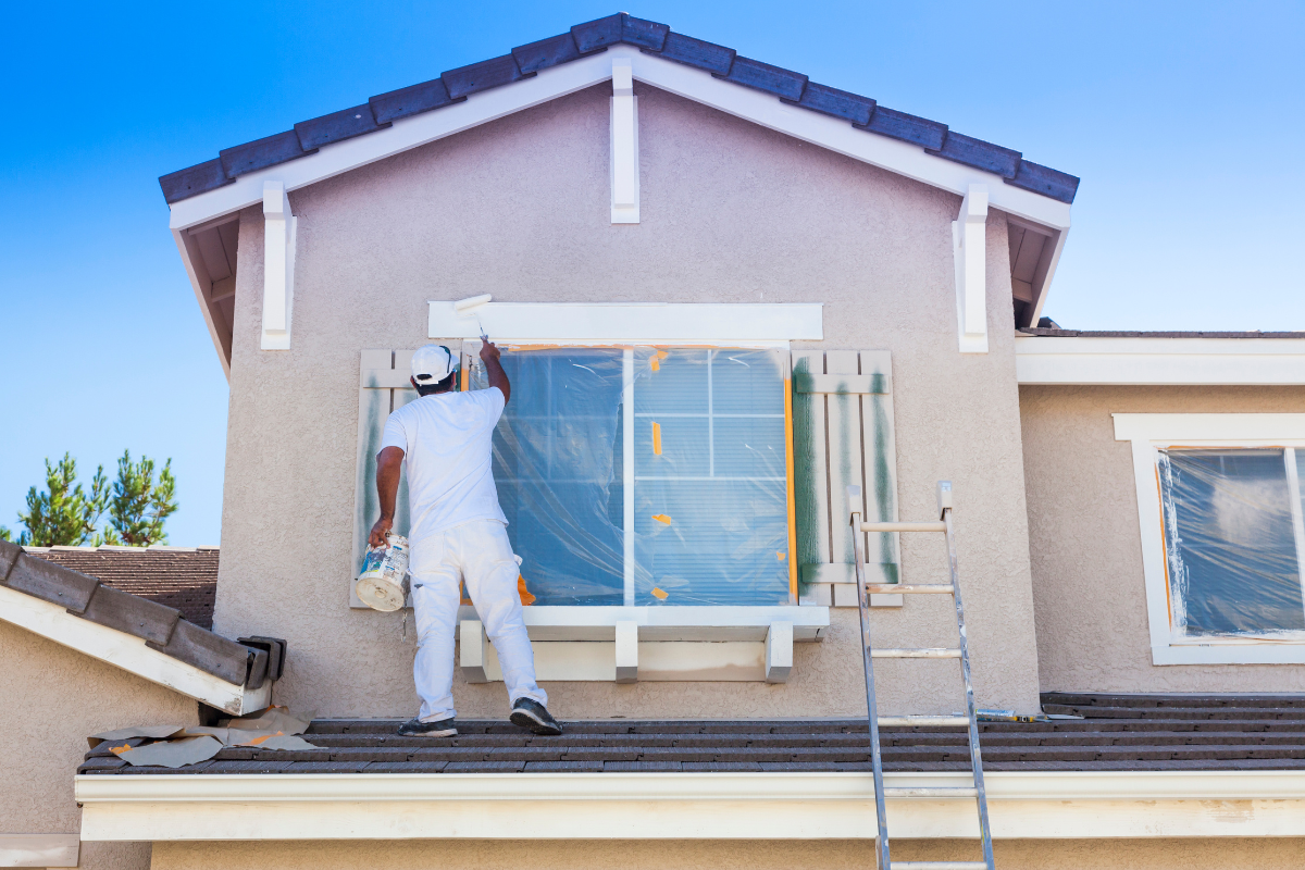 House painter painting a home's exterior